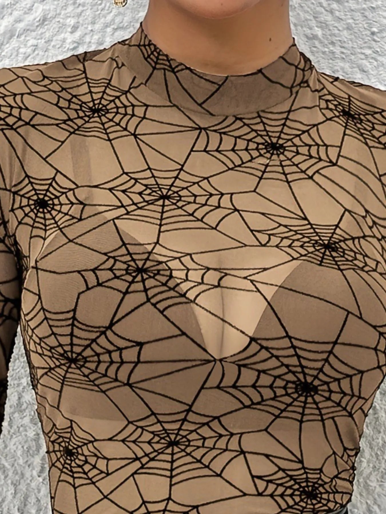 genomskinlig topp med mönster